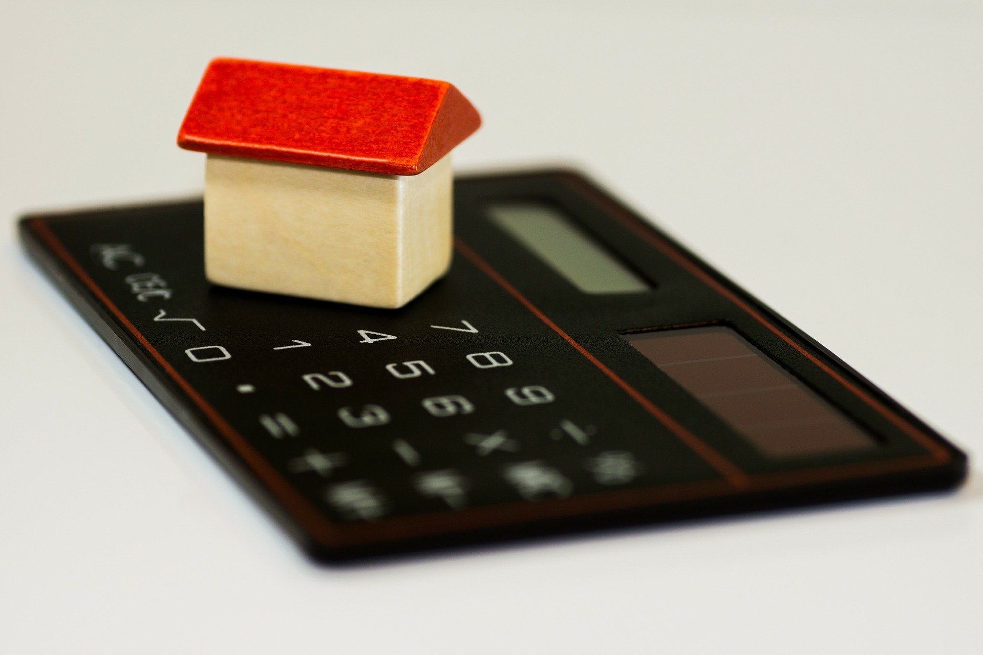 Image of a house on a calculator.